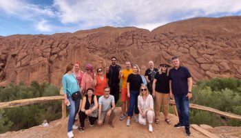 Group of tourists enjoying a 4-day tour from Marrakech to desert.
