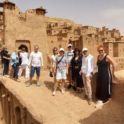 Tourists at a historical Moroccan kasbah on a 5 days tour from Marrakech